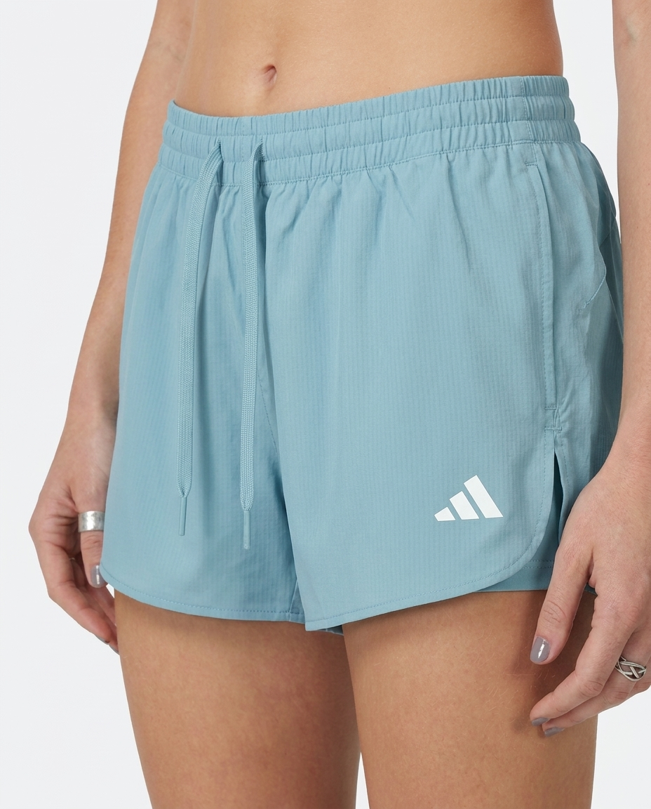 Short Dama Celeste Adidas - Detalle macro de tela