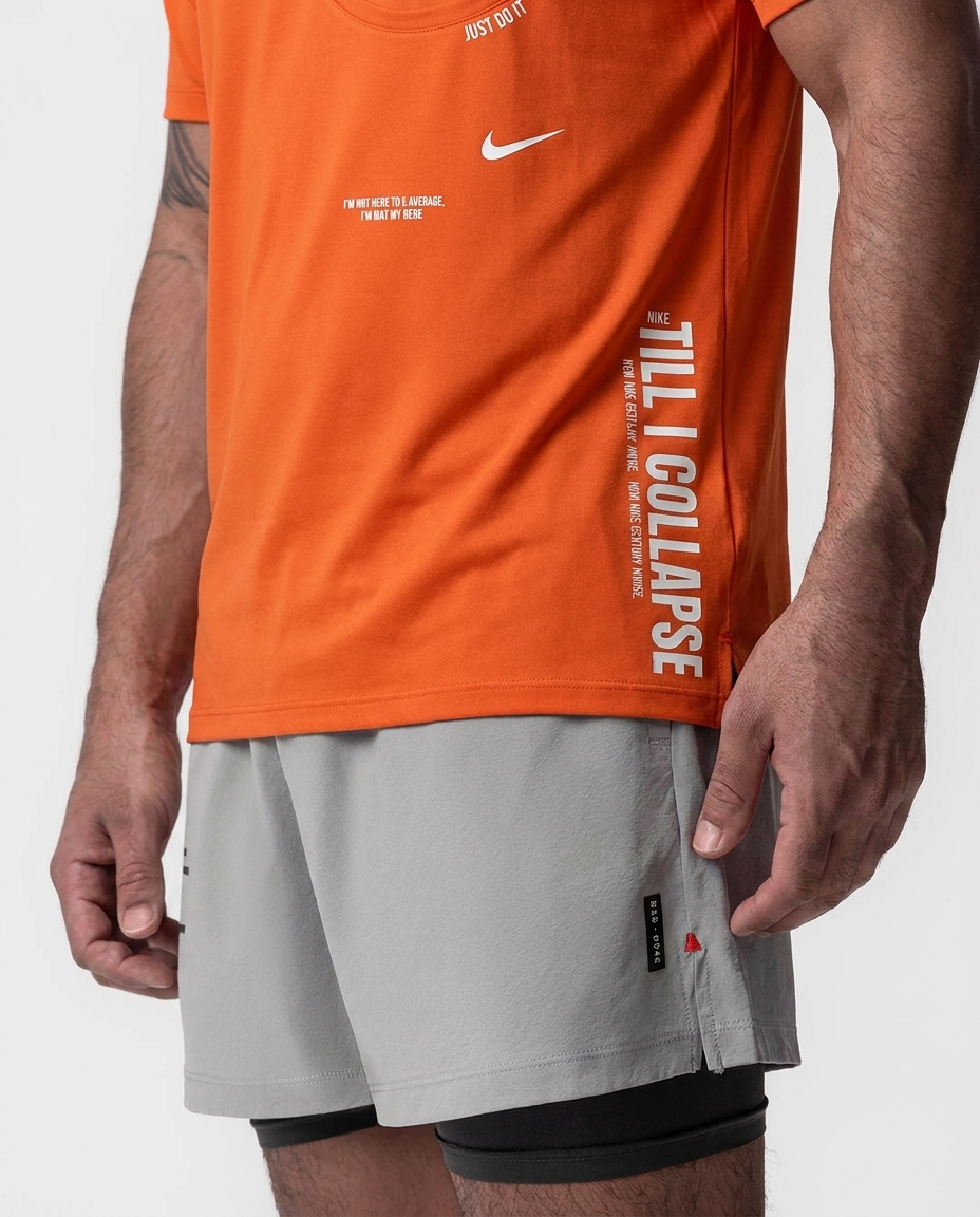 Camiseta Till I Collapse Naranja NK — macro detalle